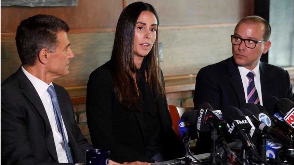 Former sports reporter Kelli Tennant, center, and her attorneys, Garo Mardirossian, left, and David de Robertis hold a news conference to discuss her sexual assault allegation against former Los Angeles Lakers head coach Luke Walton in the mid-Wilshire District in Los Angeles on April 23, 2019.
