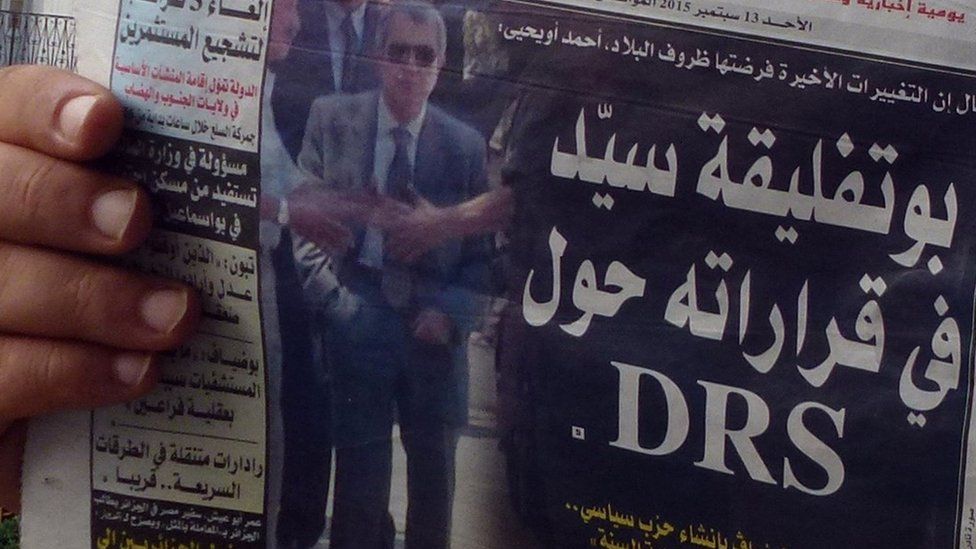 A newspaper photo of Mohamed Mediene