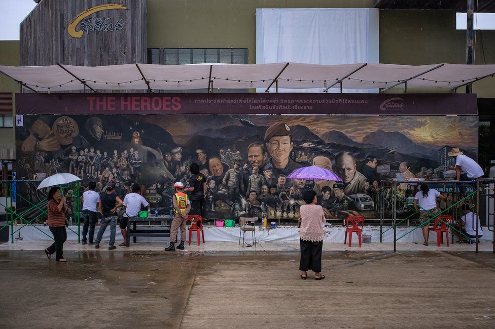 Artists work on an art mural at Art Bridge gallery in Chiang Rai, Thailand