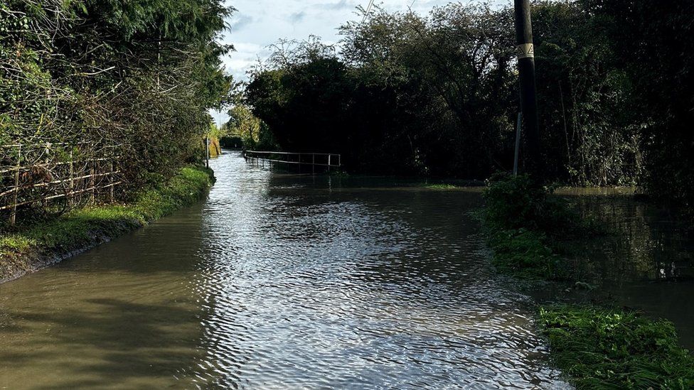 A flooded Church Lane in Gloucester