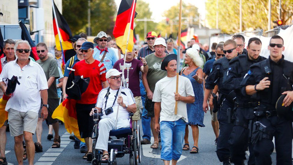 Hundreds of protesters took to the streets of Dresden when the chancellor visited on 16 August