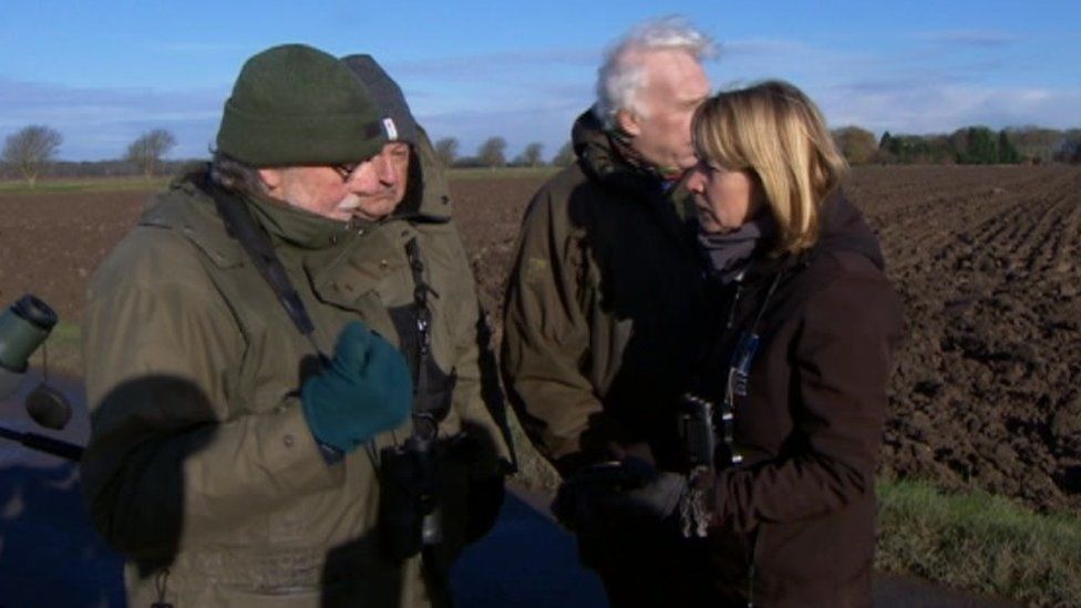 Wildlife guide Margaret Boyd chats with bird-watchers near the Humber estuary