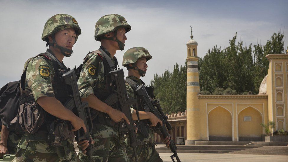 Chinese police on a past patrol in Xinjiang province