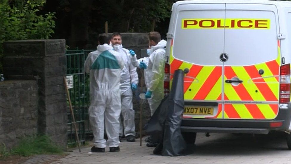 Forensic officers on site in the Quaker memorial garden