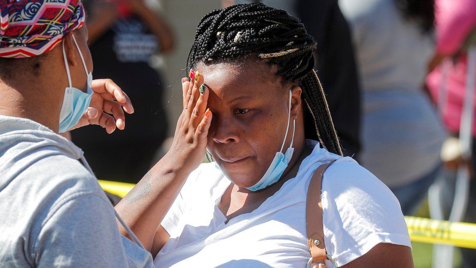 Residents of the Oakwood Plaza apartments react in the aftermath of flooding that was caused by the remnants of Tropical Storm Ida, which brought drenching rain, flash floods and tornadoes to parts of the northeast, in Elizabeth, New Jersey, U.S., September 2, 2021.