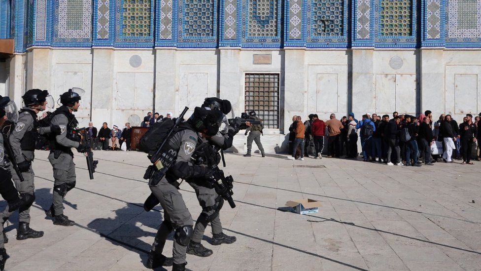 Israeli police clash with Palestinians near the Dome of the Rock, in the al-Aqsa Mosque compound, on 15 April 2022