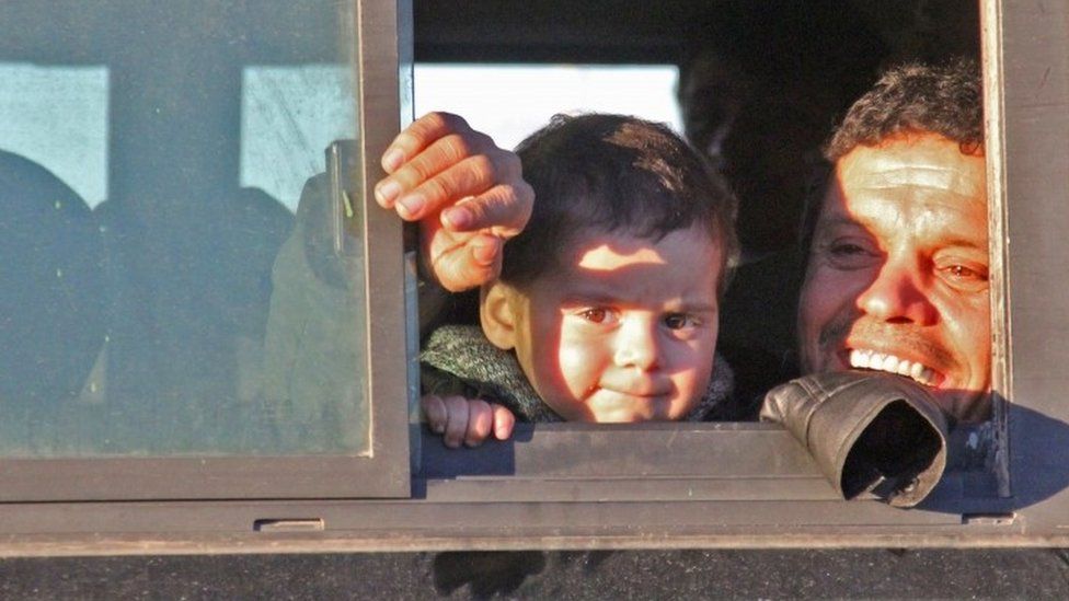 Syrians, who were evacuated from rebel-held neighbourhoods in the embattled city of Aleppo, arrive in the opposition-controlled Khan al-Aassal region, west of the city, on December 15, 2016