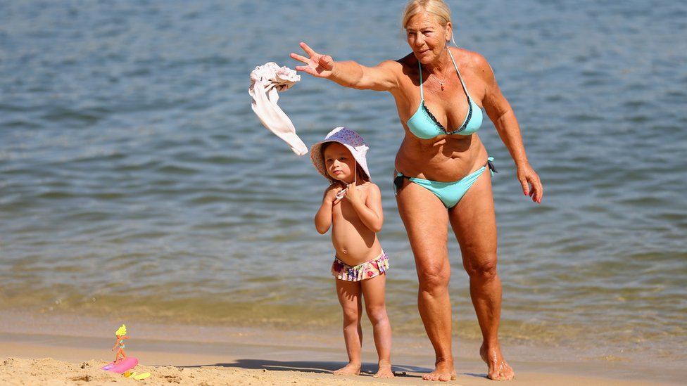 Grandmother and granddaughter take a dip in the water at Red Leaf Beach on January 15, 2019 in Sydney, Australia