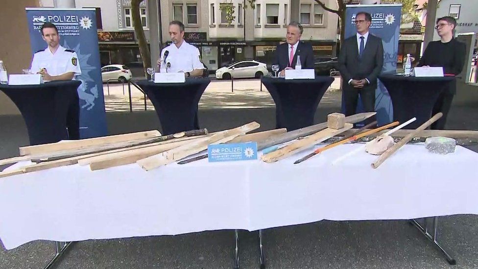 Authorities hold a briefing and display some of the items they said were used to attack police
