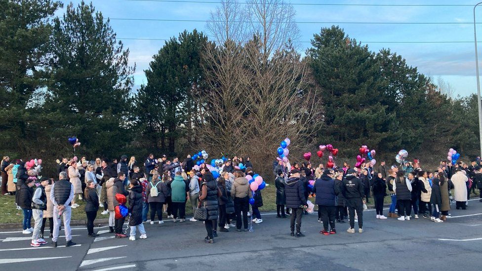 People with balloons astatine  vigil