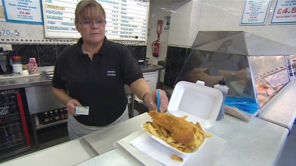 Billie Cockerell serving fish and chips in her shop