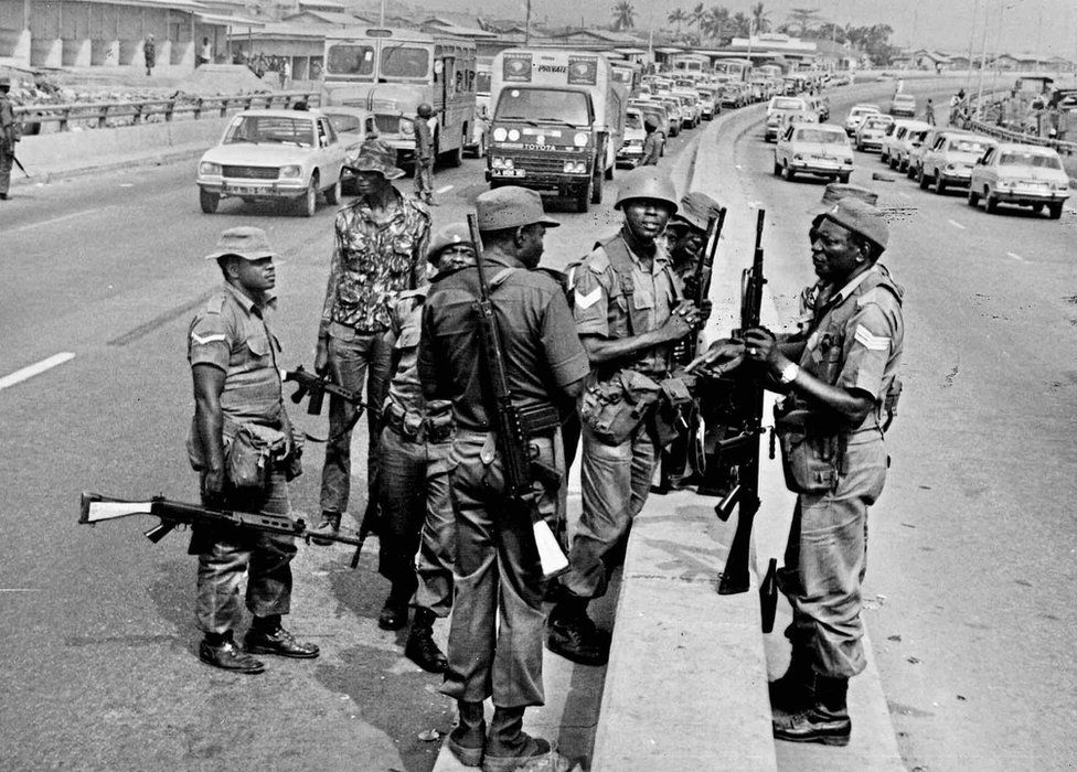 A photo by Sunmi Smart-Cole entitled: "Never Again!" (Muhammadu Buhari's coup) - 31 December 1983, armed Nigerian soldiers seen on the streets