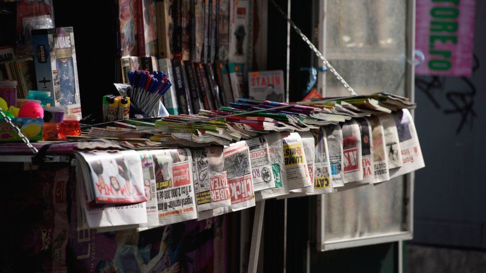 Newspapers are seen on sale at a kiosk in central Bucharest, Romania on April 30, 2019