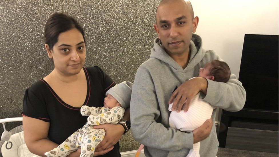 Manisha and Metaish Parmar holding their two babies