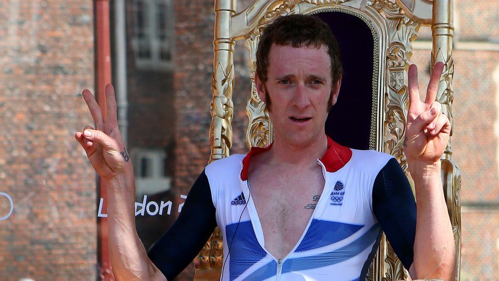 Bradley Wiggins celebrates after winning gold in the Men"s Individual Time Trial Road Cycling at the London 2012 Olympic Games