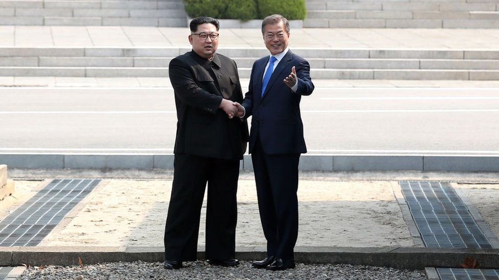 Kim Jong-un and Moon Jae-in shake hands in the JSA, April 2018