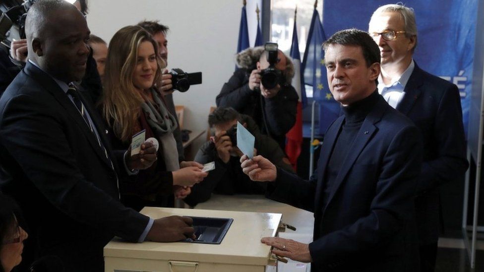 Former French Prime Minister and candidate Manuel Valls votes in the first round of the French left's presidential primary election
