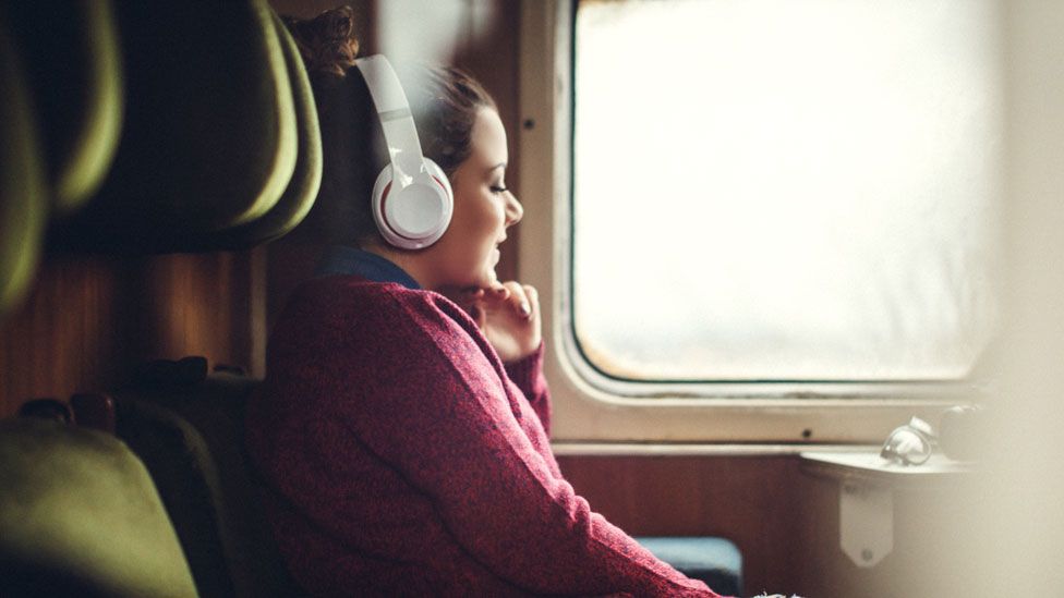 Woman listening to podcast