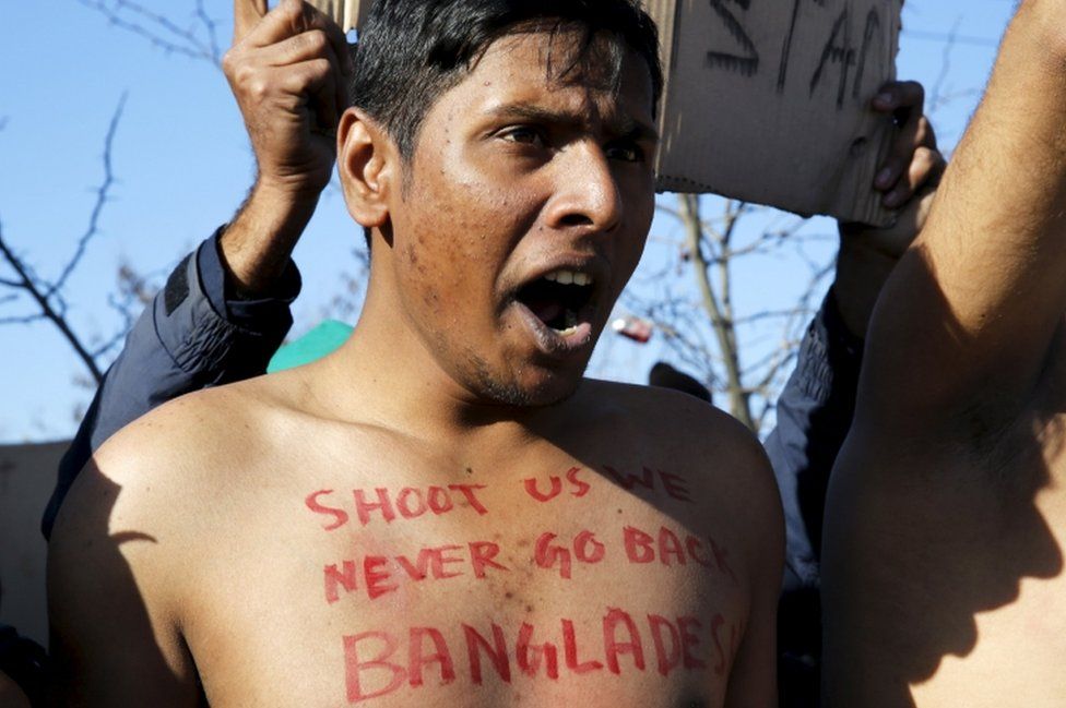 Bangladeshi migrant shout during protest on border between Greece and Macedonia