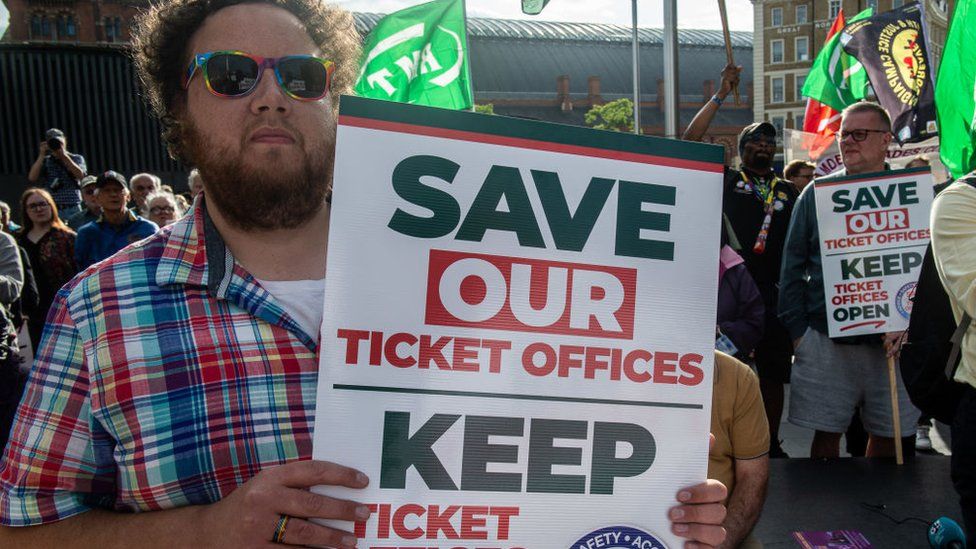 Man protesting closure of ticket offices in England