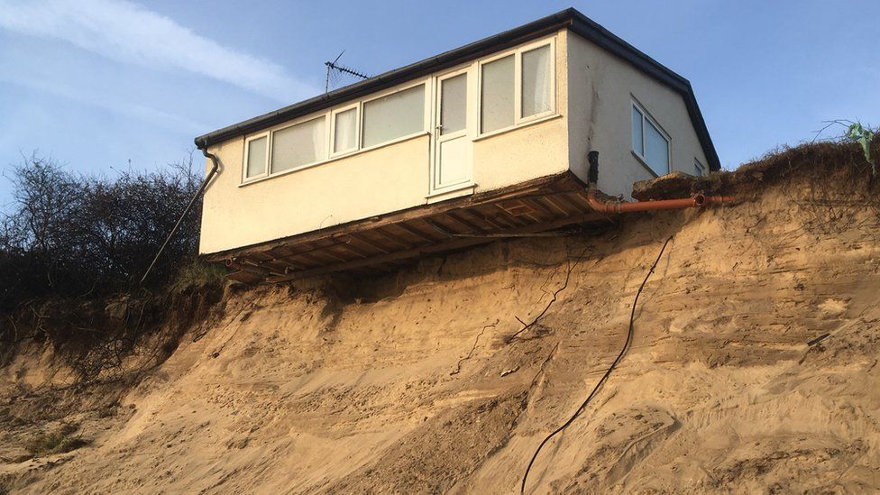 Hemsby house teetering over the sand dune