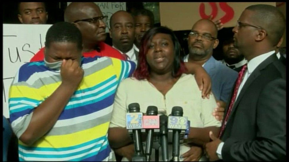 Family members of Alton Sterling, who was shot and killed at the hands of police, speal at a news conference.
