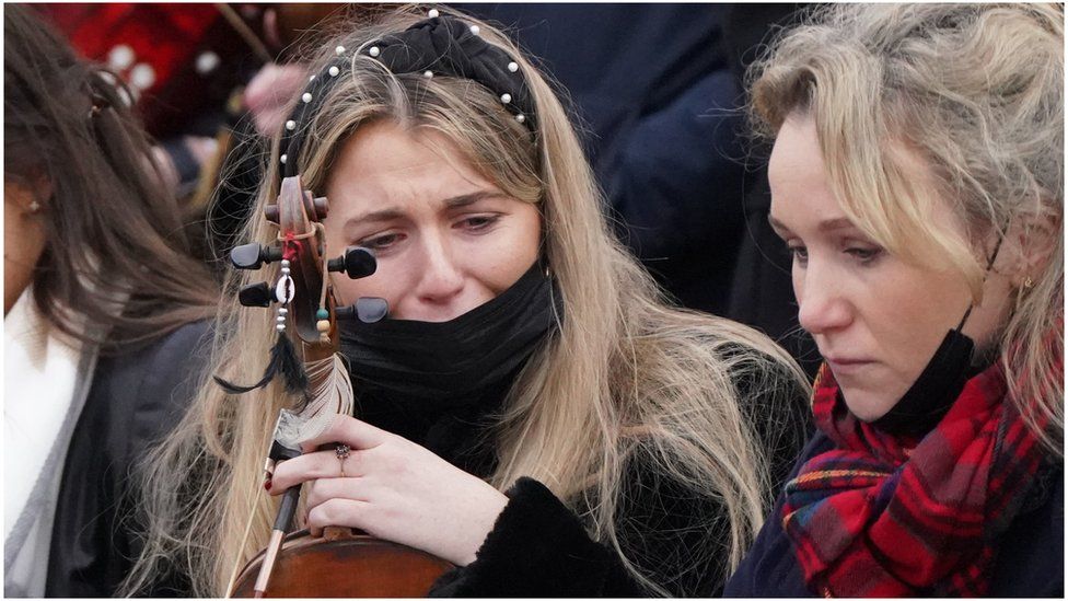 Musicians forming the guard of honour wait outside St Brigid"s Church, Mountbolus, County Offaly, during the funeral of schoolteacher Ashling Murphy who was murdered in Tullamore, Co Offaly last Wednesday. 23-year-old Ashling, a talented musician, was found dead after going for a run on the banks of the Grand Canal in Tullamore. Picture date: Tuesday January 18, 2022.