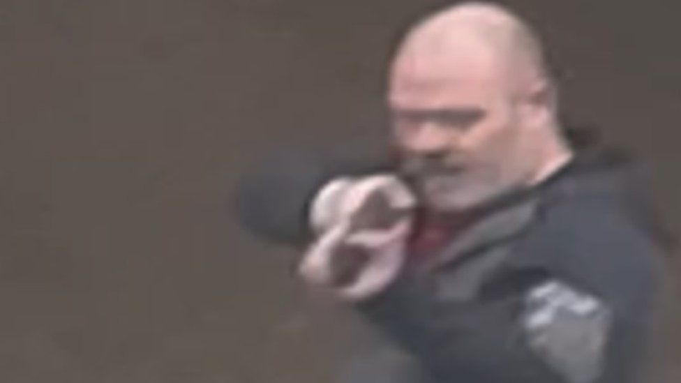 still from footage showing Shaun Wakefield pointing a gun