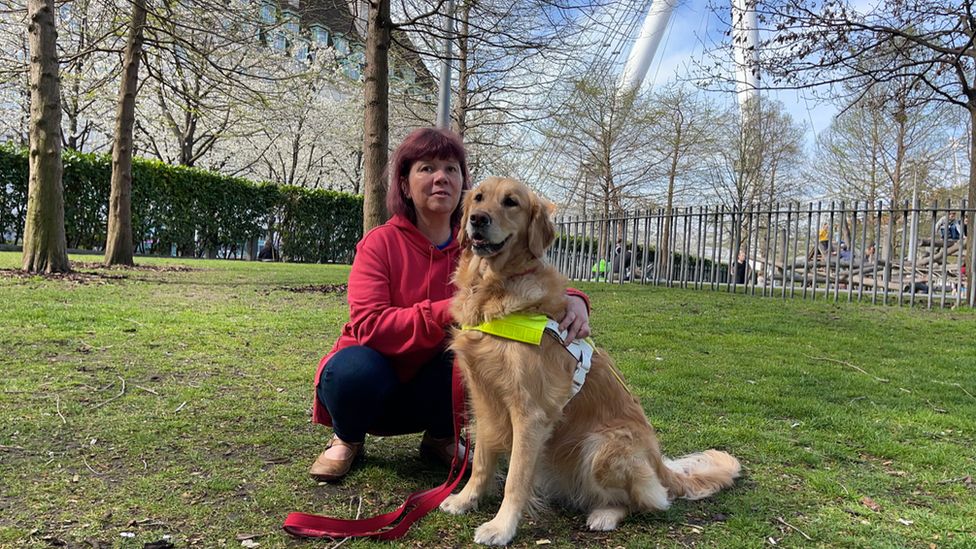 Sarah Leadbetter with her guide dog Nellie in London