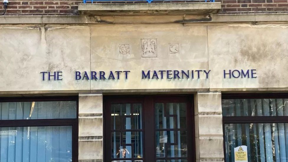 Stone building with "The Barratt Maternity Home" above the door