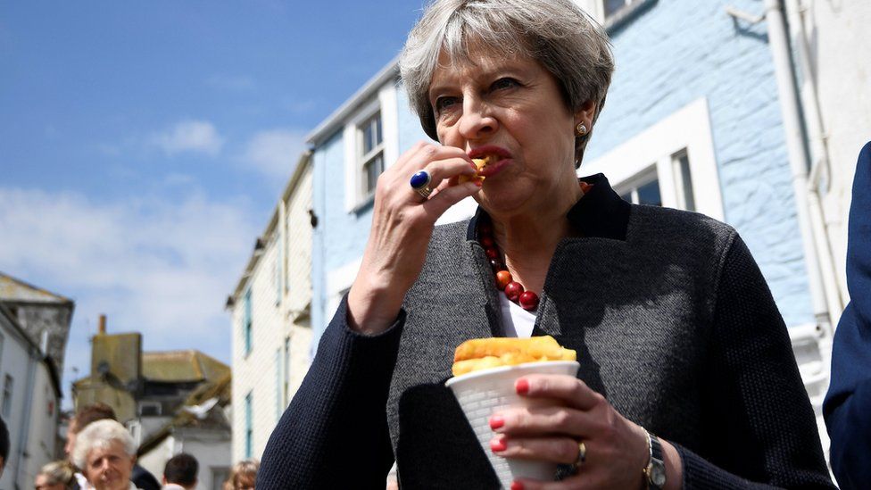 Theresa May eating chips