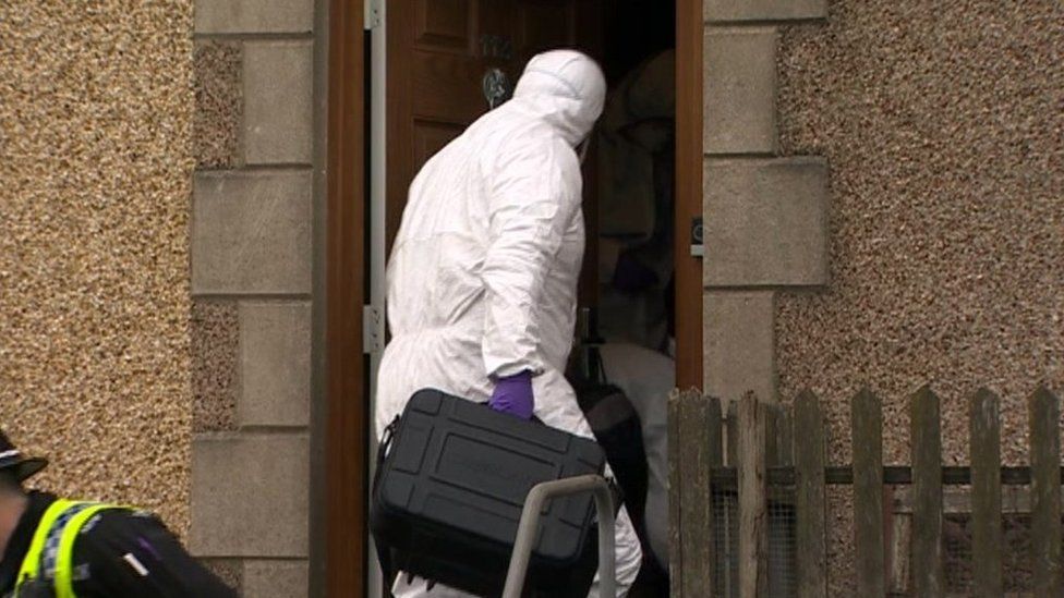 Forensics officers at the house in Pentrechwyth Road, Swansea