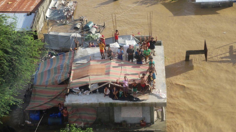 Severe flooding in the Philippines trapped people on rooftops in northeastern Luzon island