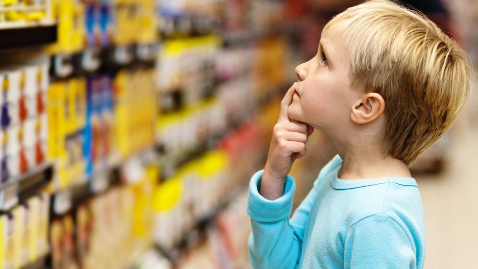 Child making a decision at the supermarket