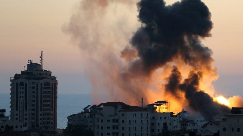 Smoke and flames rise during Israeli air strikes, in Gaza city