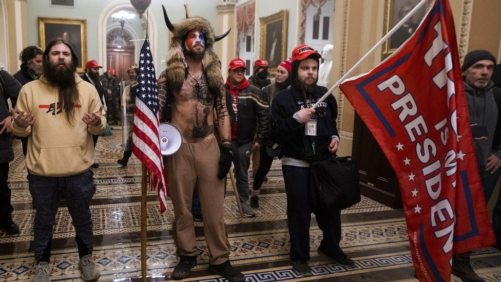 US Elections protest: Jacob Chansley (C) with other Pro-Trump supporters, as they demonstrate ouside Senate Chamber at the U.S. Capitol after breaching security, January 6th 2021