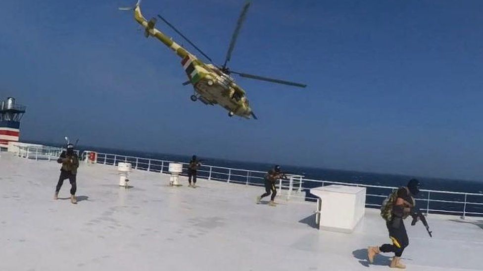 Houthi military helicopter hovers over the Galaxy Leader cargo ship in Red Sea in November 2023