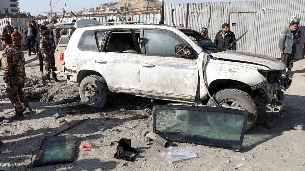 Afghan security officials inspect the site of a bomb blast in Kabul, Afghanistan December 15, 2020