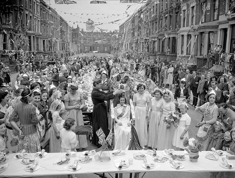 There were many Coronation party street scenes across the UK in 1953, including this one in London, where 14 year-old Maureen Atkins was crowned Queen
