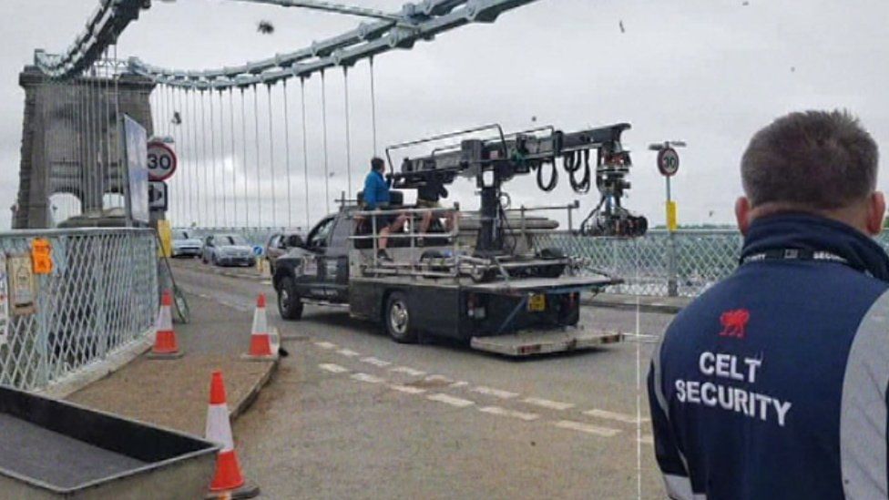 The crew filming on the bridge