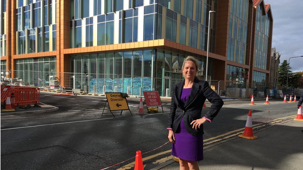 Louise Emery outside Conwy council's new offices in Colwyn Bay