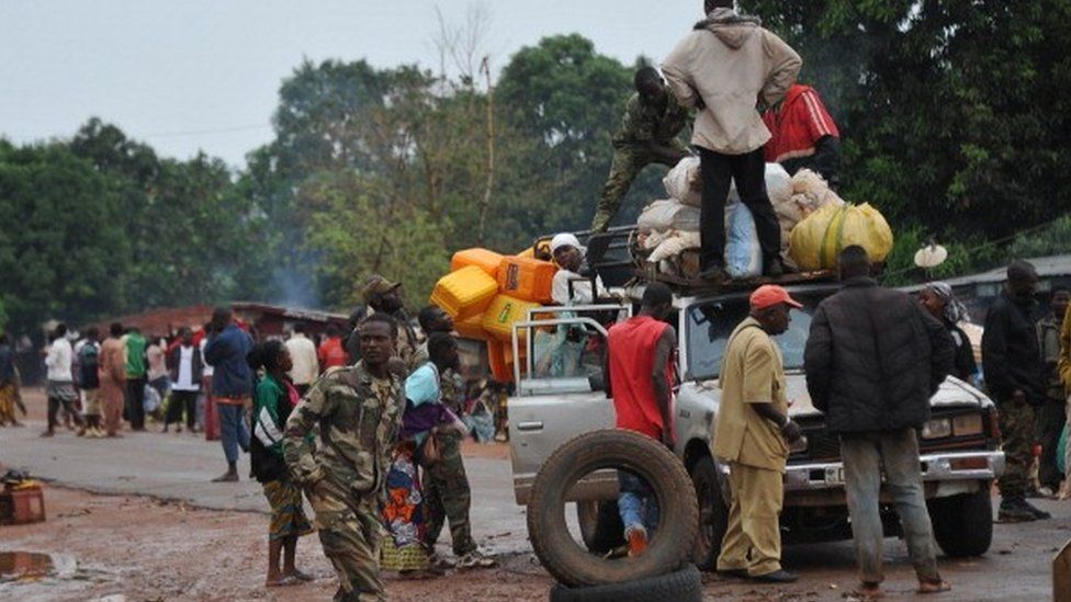 Members of the anti-Balaka Christian militia search a vehicle at a check-point in Pissa, 70 km south of Bangui, on March 3, 2014