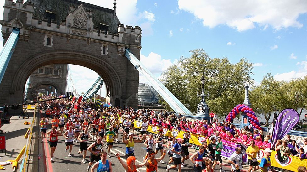 Runners cross Tower Bridge during the London Marathon
