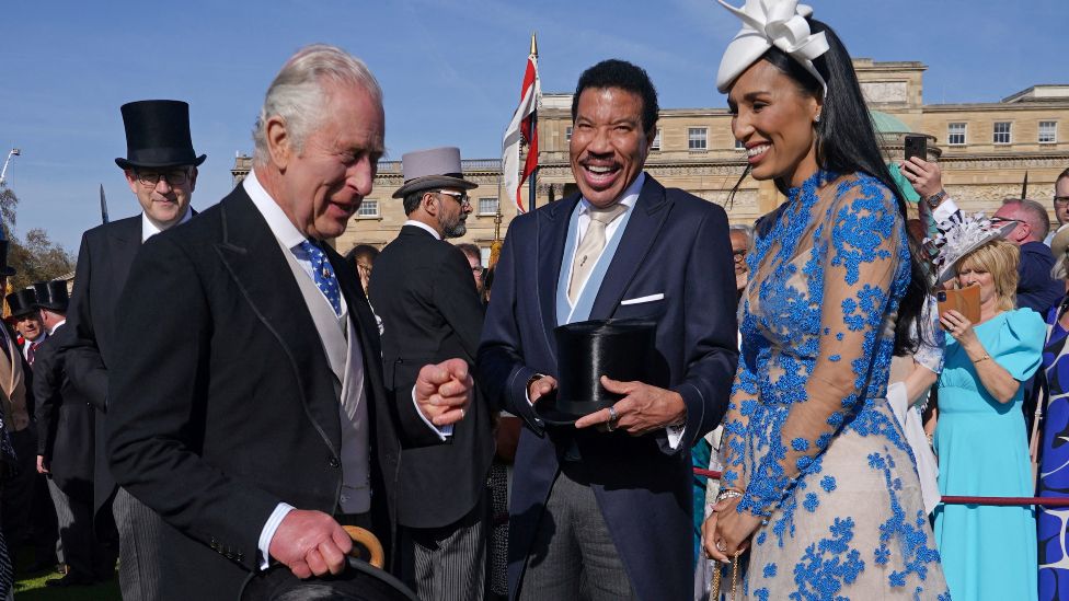 King Charles speaks with Lionel Richie and Lisa Parigi during a Garden Party, in celebration of King Charles' coronation, at Buckingham Palace, London, Britain. Picture date: Wednesday May 3, 2023