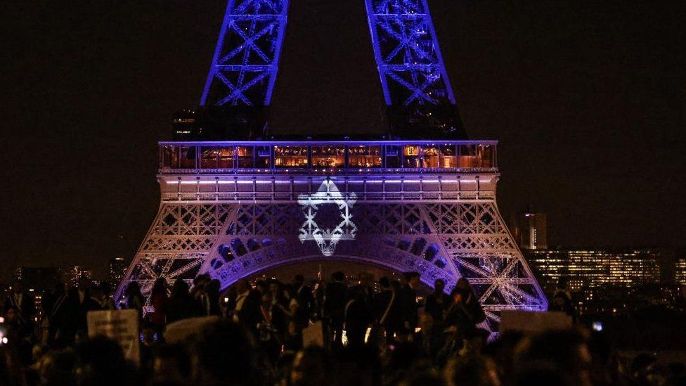 The Eiffel Tower lit up in the colours of the Israeli flag after a Hamas attack killed over 1,300 on 7 October