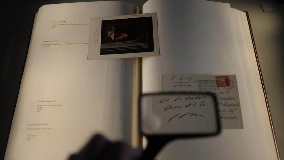 A document signed by Samuel Beckett ,is viewed during a photocall in the Long Room at Trinity College, Dublin, as the library unveils the largest collection of Samuel Beckett letters ever offered for public sale.