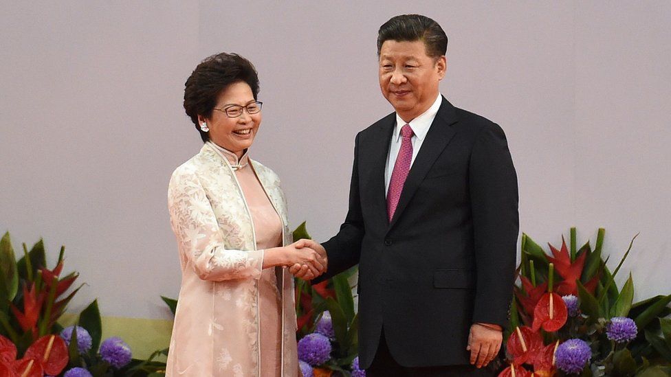 Hong Kong's new Chief Executive Carrie Lam (L) shakes hands with China's President Xi Jinping (R) after being sworn in as the territory's new leader at the Hong Kong Convention and Exhibition Centre in Hong Kong on 1 July, 2017.