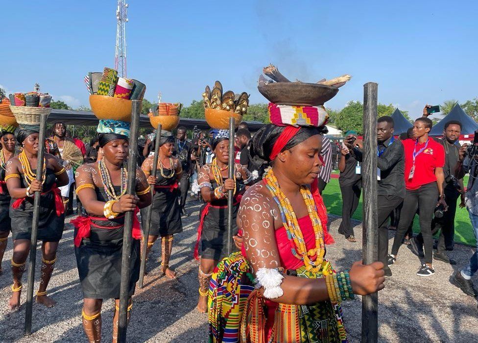 Mourners wearing traditional regalia