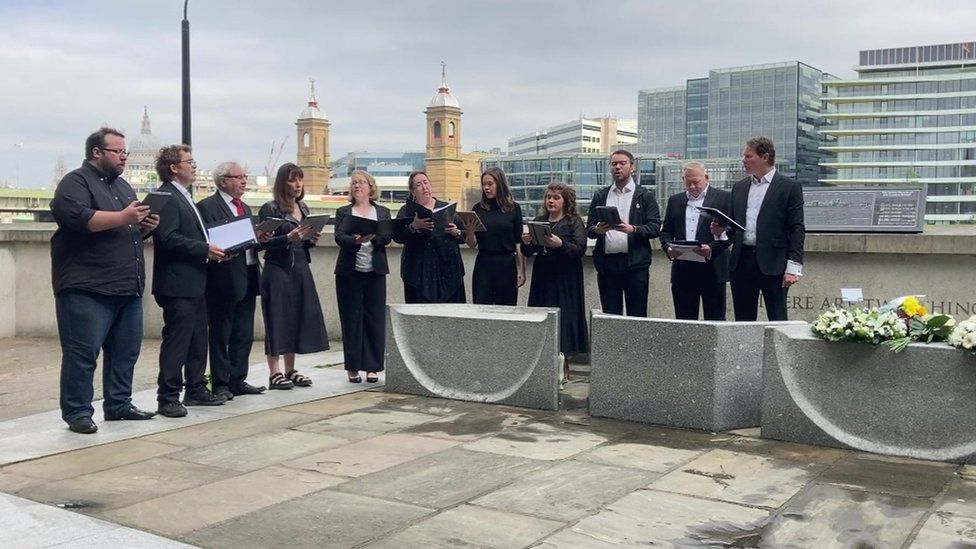 People singing next Southwark Cathedral