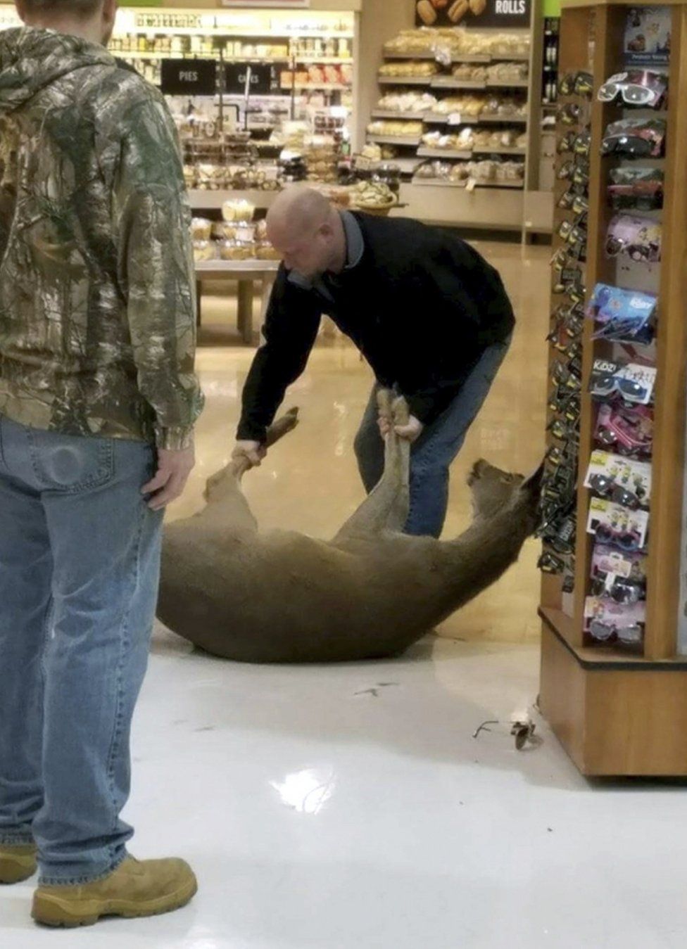 Other shoppers said the deer was caught within one minute of bursting into the grocery store